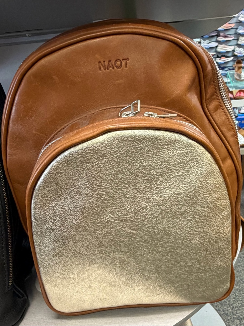 NAOT women’s Tan and Metallic Gold Leather Backpack